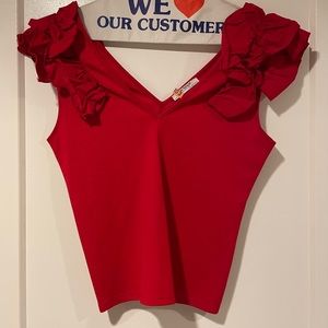 Sleeveless crop top with ruffle shoulders